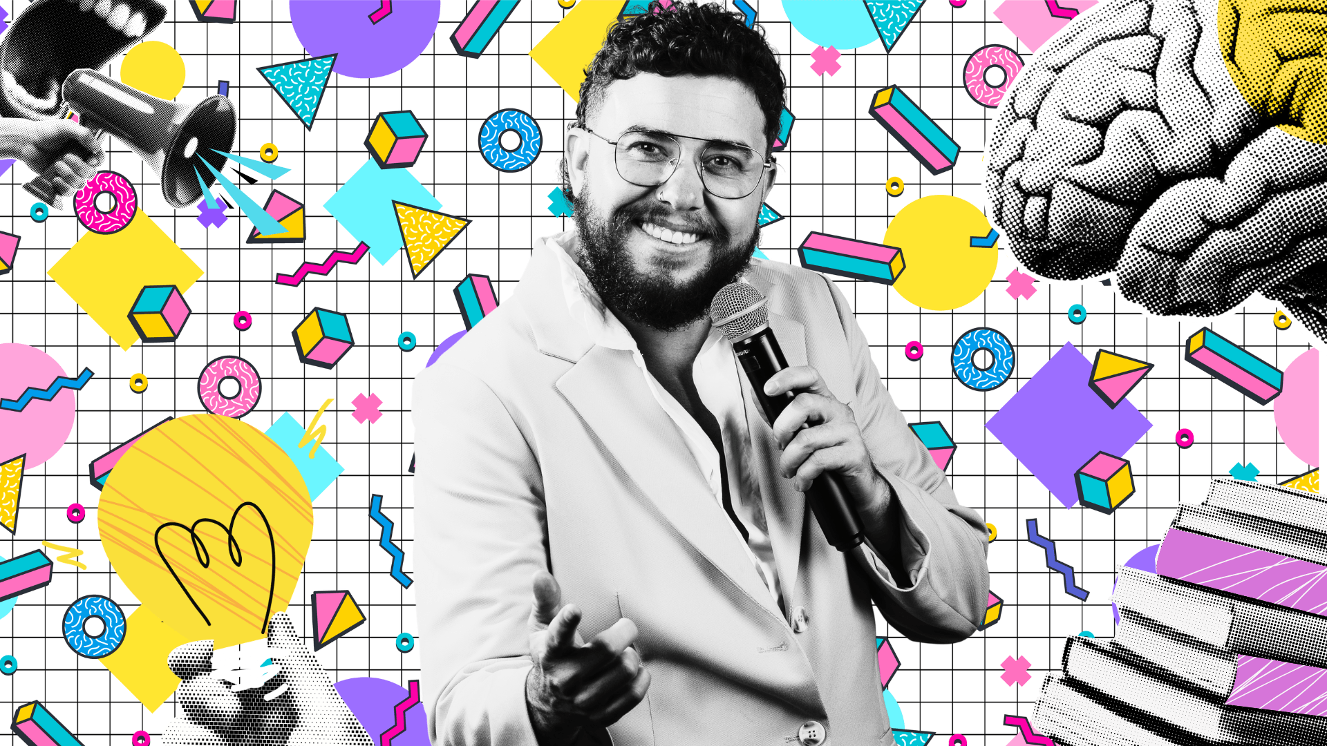A man in a light suit holds a microphone and smiles, pointing towards the camera. The background is colorful and retro, featuring geometric shapes, a brain, a light bulb, and books on a grid pattern.